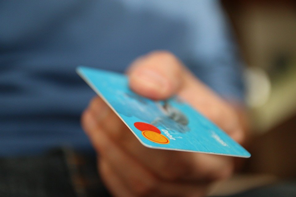 A person paying with a mastercard debit.
